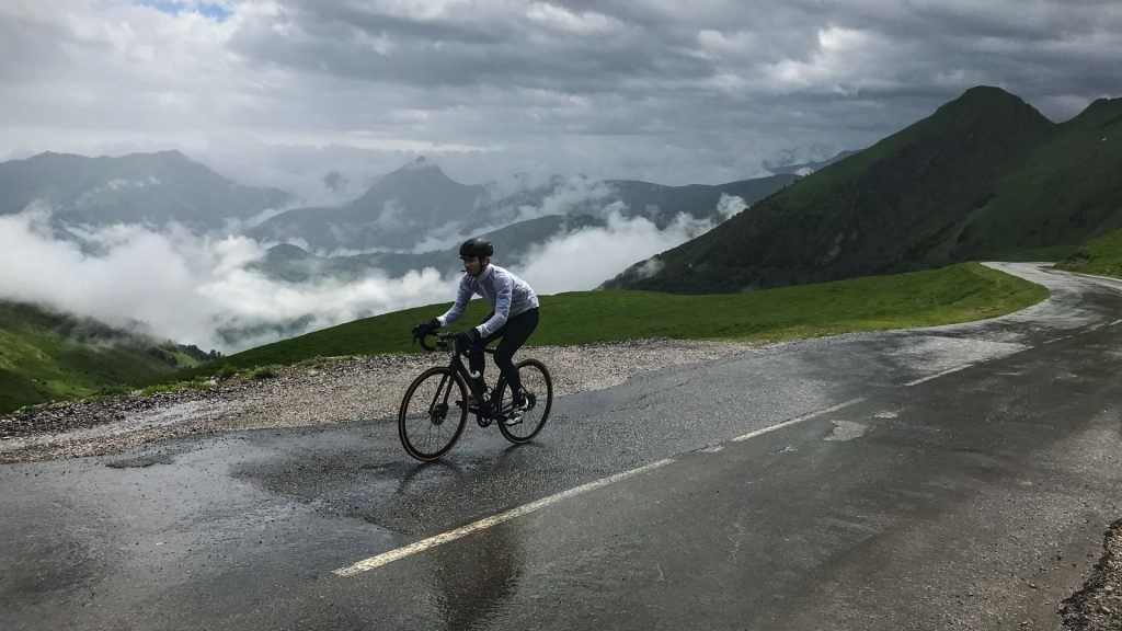 Cyclist on the Col d'Aubisque surrounded by clouds