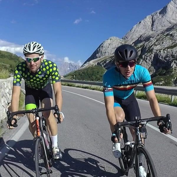 Two cyclists in Stolen Goat cycling jerseys