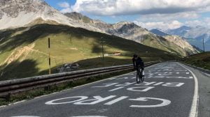 Cyclist climbing Passo dello Stelvio from Bormio