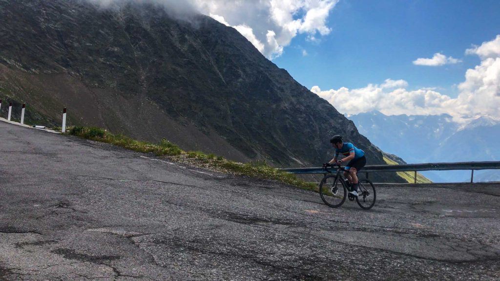 Cyclist climbing the Gavia Pass Italian Alps