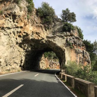 Rock tunnel on the MA-10 climbing Puig Major by bike, Mallorca