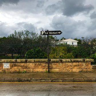 Signpost showing the way to la Victoria, Mallorca