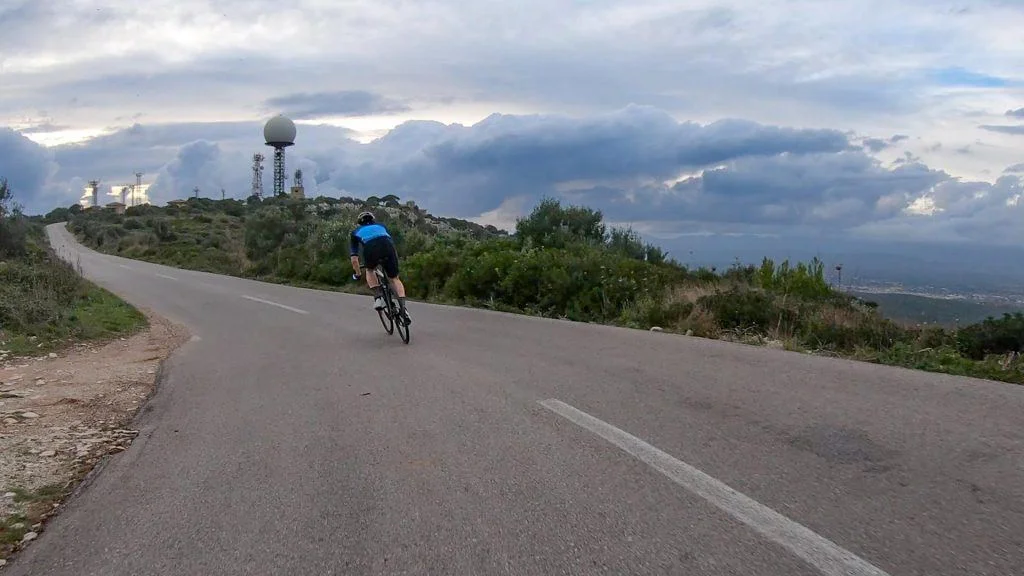 Cyclist climbing the Puig de Randa Mallorca at dusk