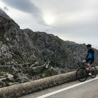 Cyclist viewing the twists of the Sa Calobra