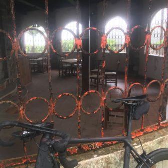 Tea plantation cafe behind rusty iron bars - very much closed