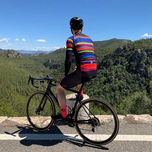 Cyclist admiring view in Prades mountains, Costa Daurada