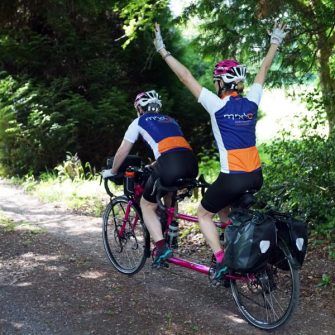 Cat and Raz in cycling kit raising money for Association of Motor Neurone Disease