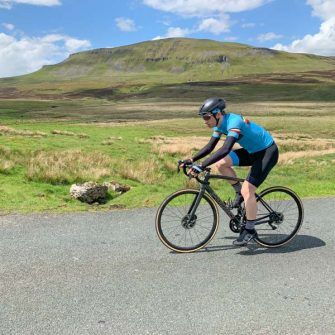 Cyclist with view to Pen-y-ghent