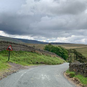 Warning sign and steep descent to Keld, Yorkshire Dales