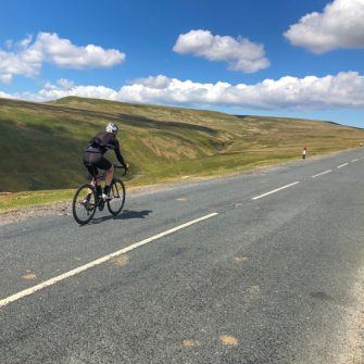 Cyclist on Greets Moss, Yorkshire Dales