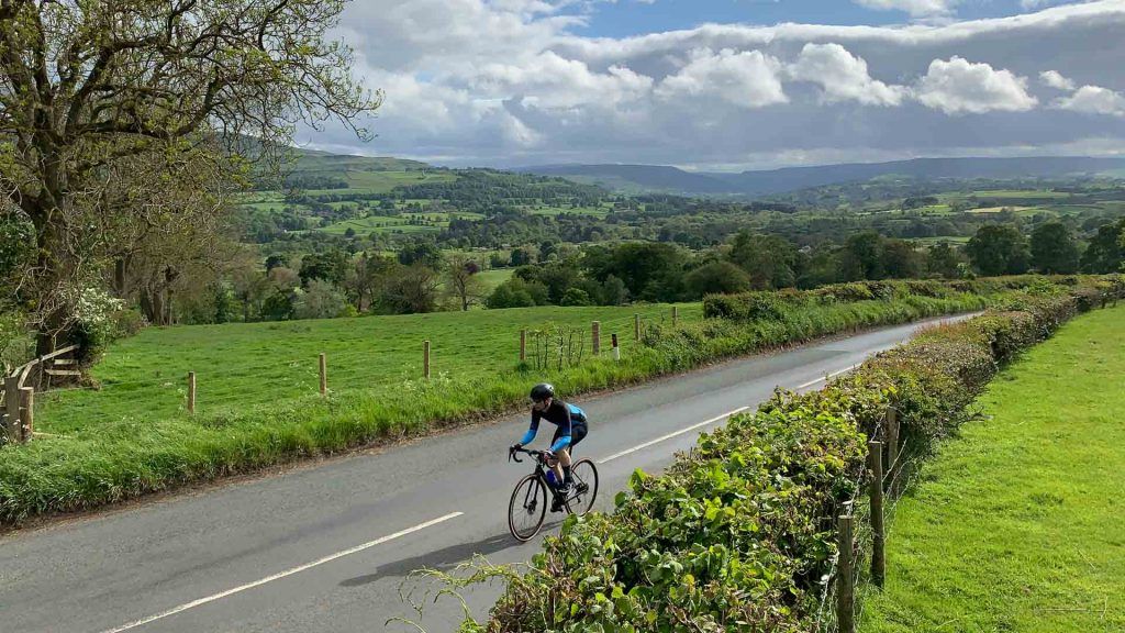 Cyclist in the Yorkshire Dales, on a loop to include Park Rash and Fleet Moss