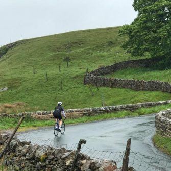 Cyclist on the Cote de Cray or Kidstones Pass, Yorkshire Dales