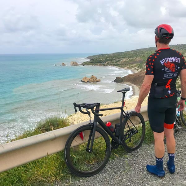 Cyclist looking at Aphrodite's Rock