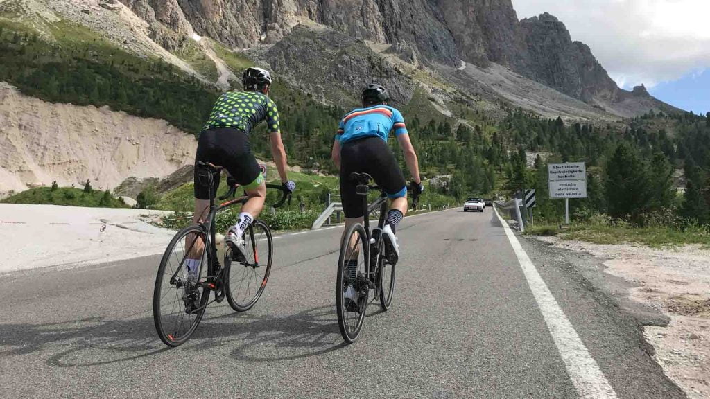 Cyclists cycling the Passo Sella, Dolomites