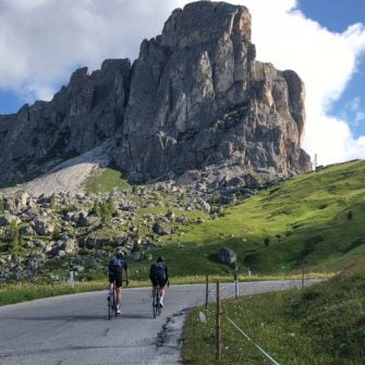 Two cyclists nearing the summit of the Passo Giau climb, Italian Dolomites