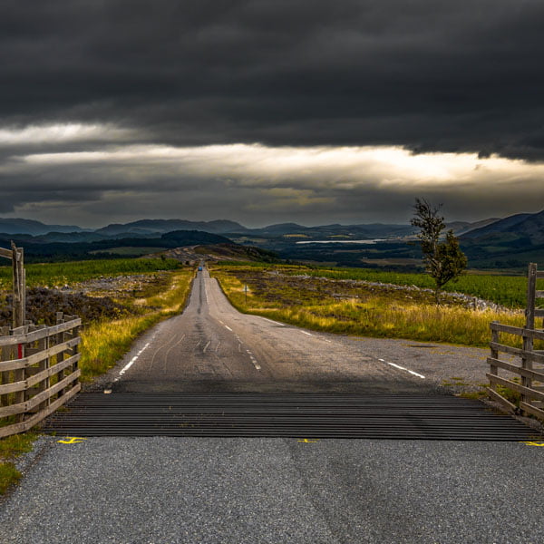 Looing clouds over a Scottish country road