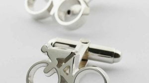 Silver cufflinks with cyclist and bicycle