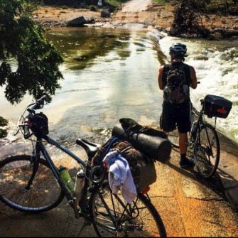 Cyclists preparing to cross a river while biking across America