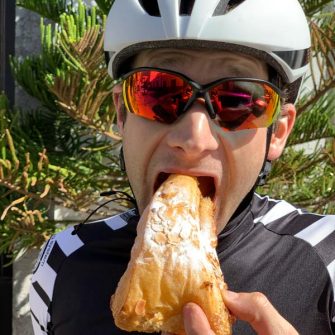 Cyclist eating a large cake in Gran Canaria