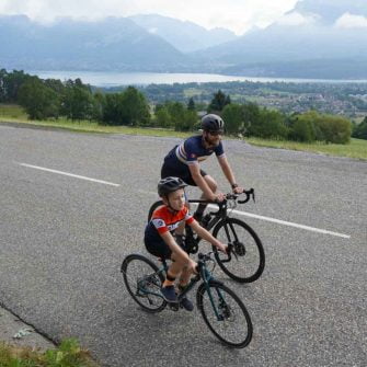 Cyclists above Lake Annecy, French Alps
