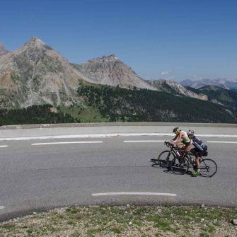Two road cyclists on the Route des Grandes Alpes