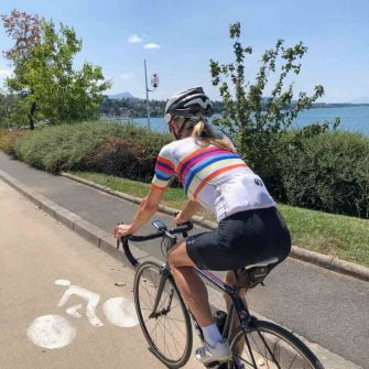 Cyclist at Thonon Les Bains by lake geneva