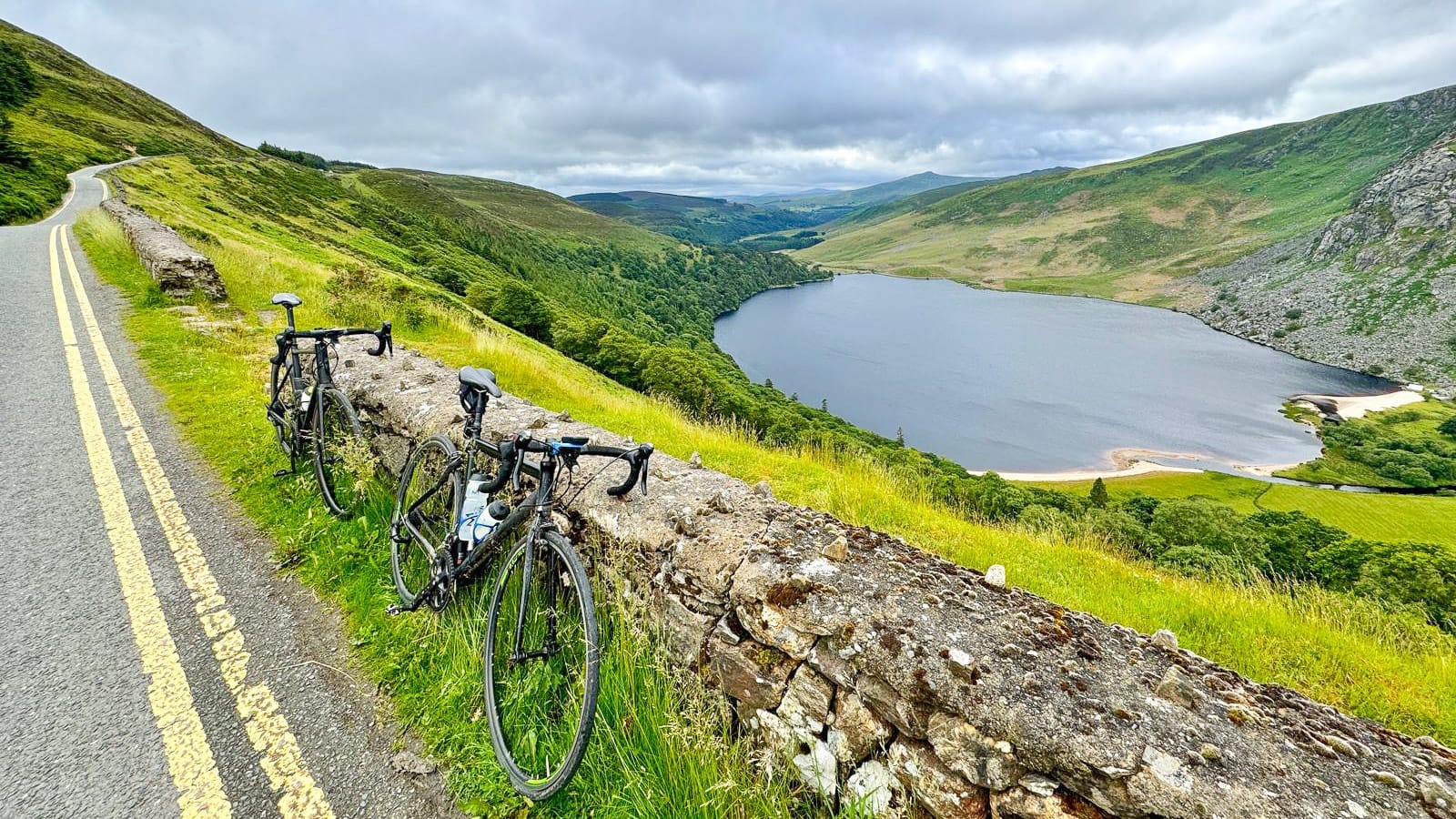 Two bikes with Loch Tay in distance