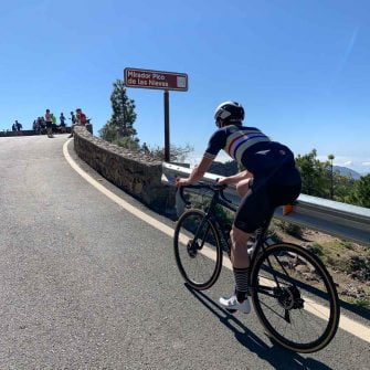 Cyclist approaching the top of the Pico de las Nieves cycling route