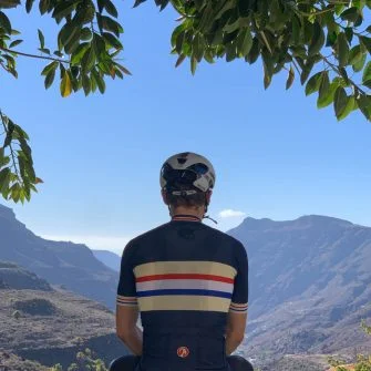 Cyclist admiring view from the top of the Soria climb