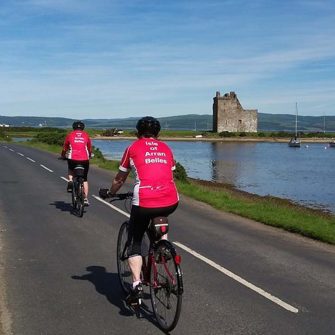 Easy cycling Isle of Arran past castle Lochranza
