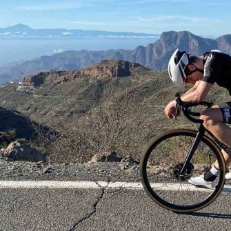 Cyclist at the summit of the Valley of Tears cycle route Gran Canaria