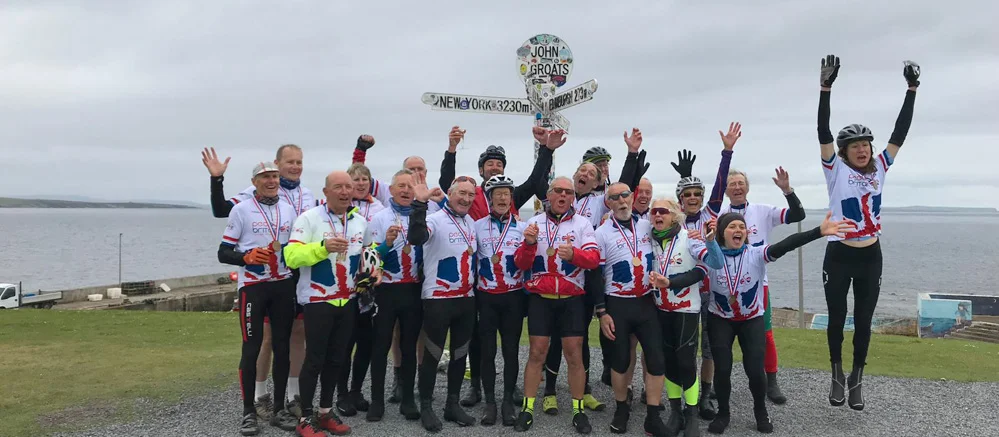 Cyclists having completed 14 day Lands End to John o Groats