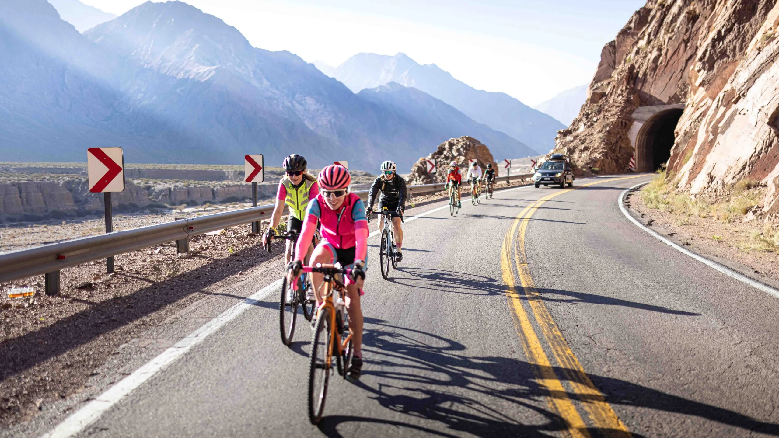 Group of cyclists cycling across South America