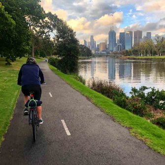 Cyclist by river in Melbourne