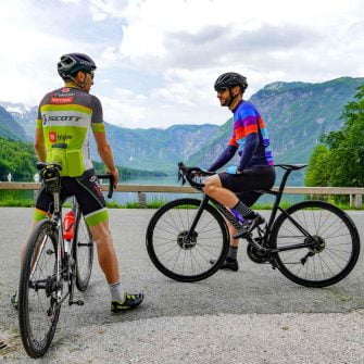 Admiring the view during a Slovenia cycling holiday at Lake Bohinj Slovenia