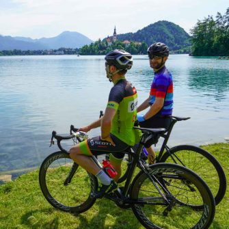 Two cyclists admiring Lake Bled in Slovenia