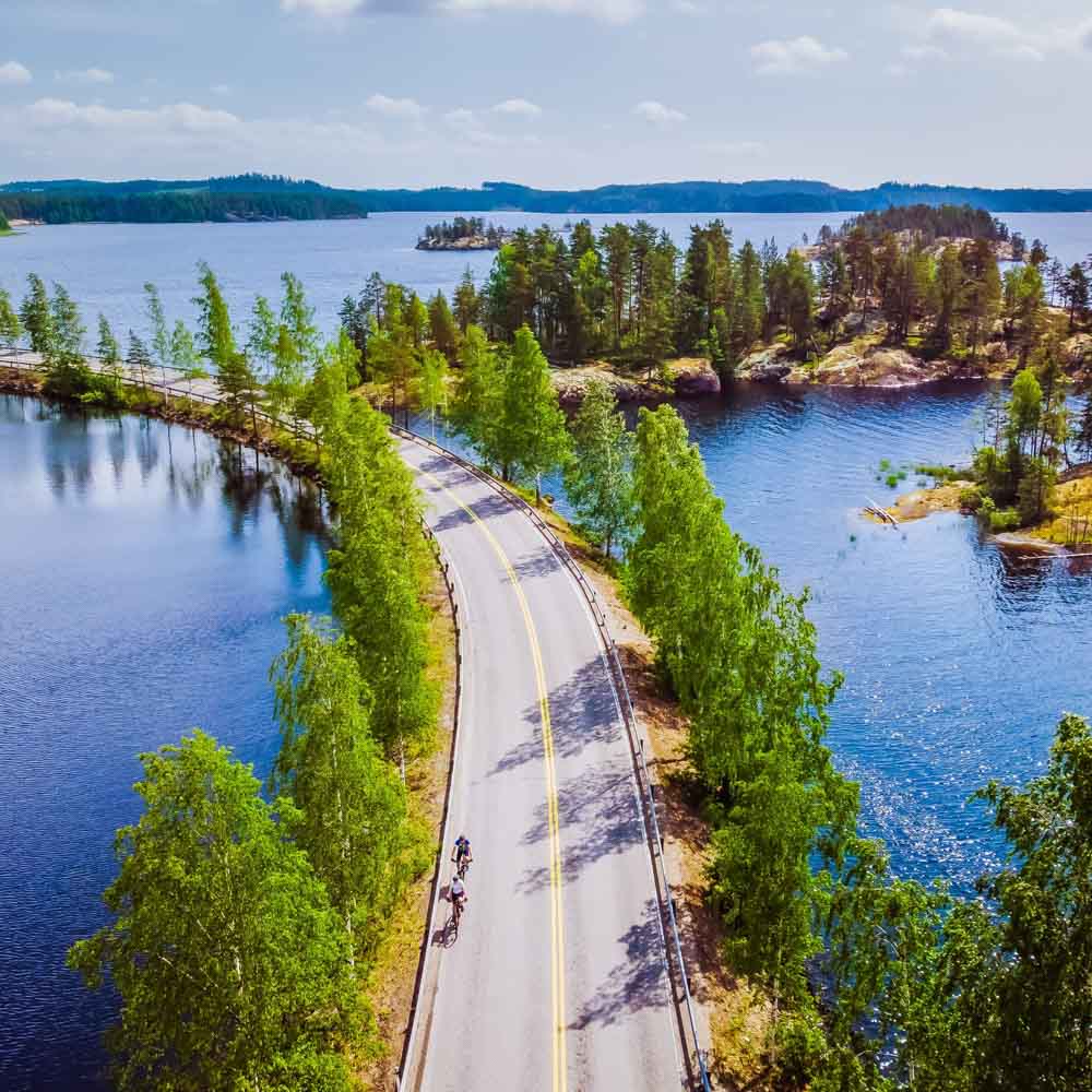 Cyclist cycling through Lake Saimaa, Finland