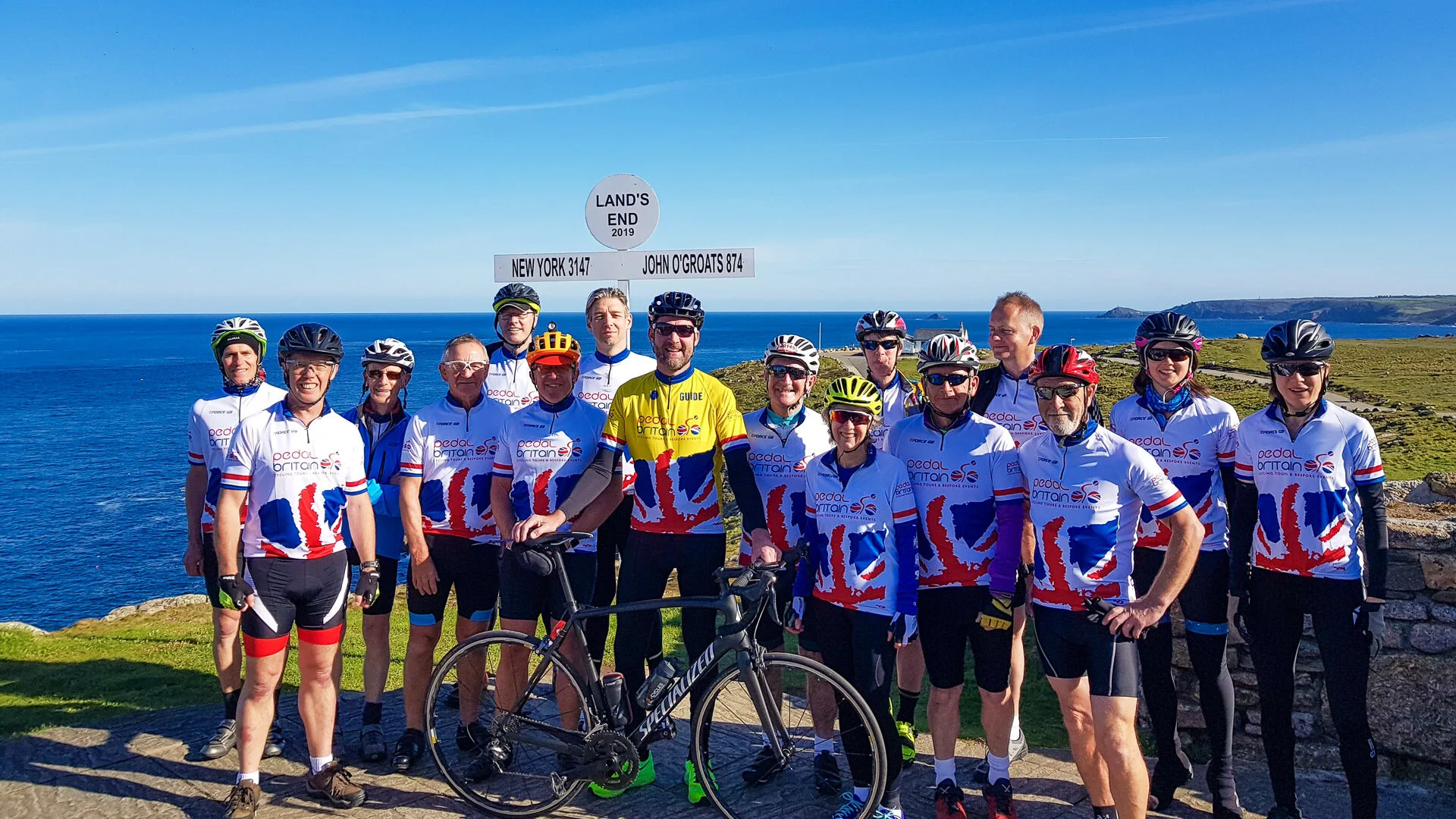 Cyclists on Lands End John O Groats attempt