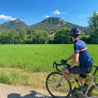 Cyclist admiring Garroxta region of Costa Brava