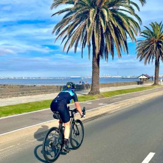 Cycling along Beach Road, Melbourne, Australia