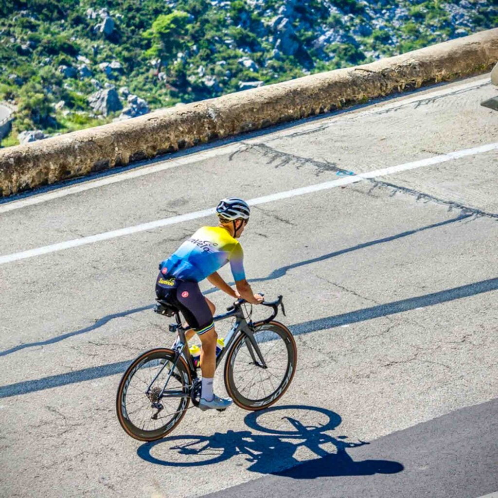 Cyclist in Sunvelo kit on a beautiful cycling climb in Mallorca
