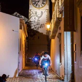 Cyclists bicycle riding at night on an Algarve cycling events