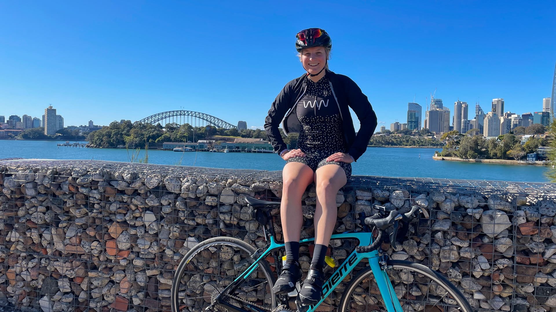 Cycling in Sydney with view of Harbour Bridge