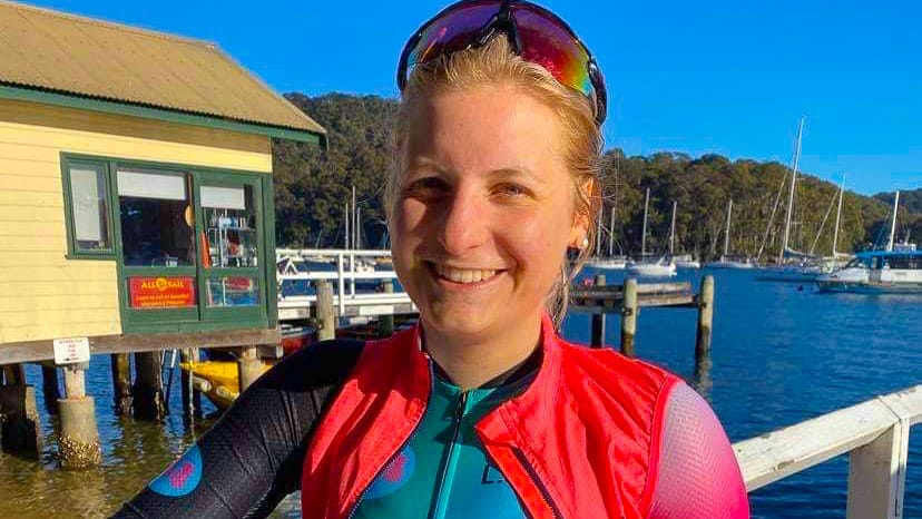 Cyclist enjoying a cup of coffee