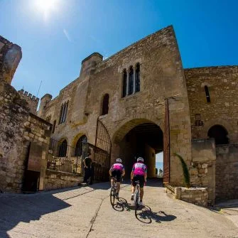 Cyclists in a medieval village Catalonia
