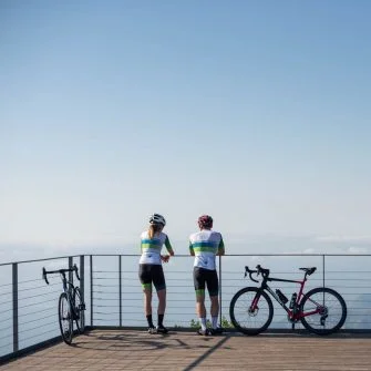 Cyclists admiring view at Mont Caro, Catalonia