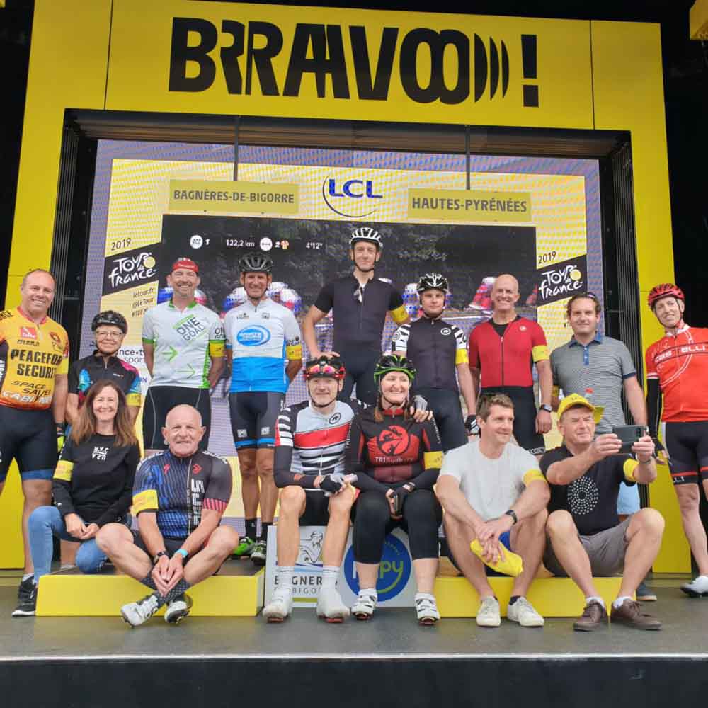Cyclists celebrating on Tour de France cycling tours