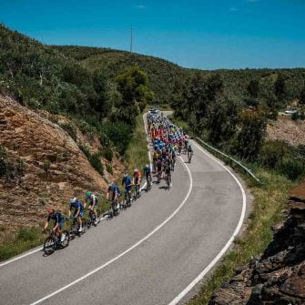 Cyclists are riding bicycles on hilly roads on Algarve cycling events