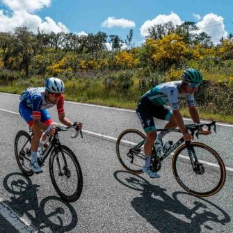 Two cyclists riding in the road on Tour of Algarve
