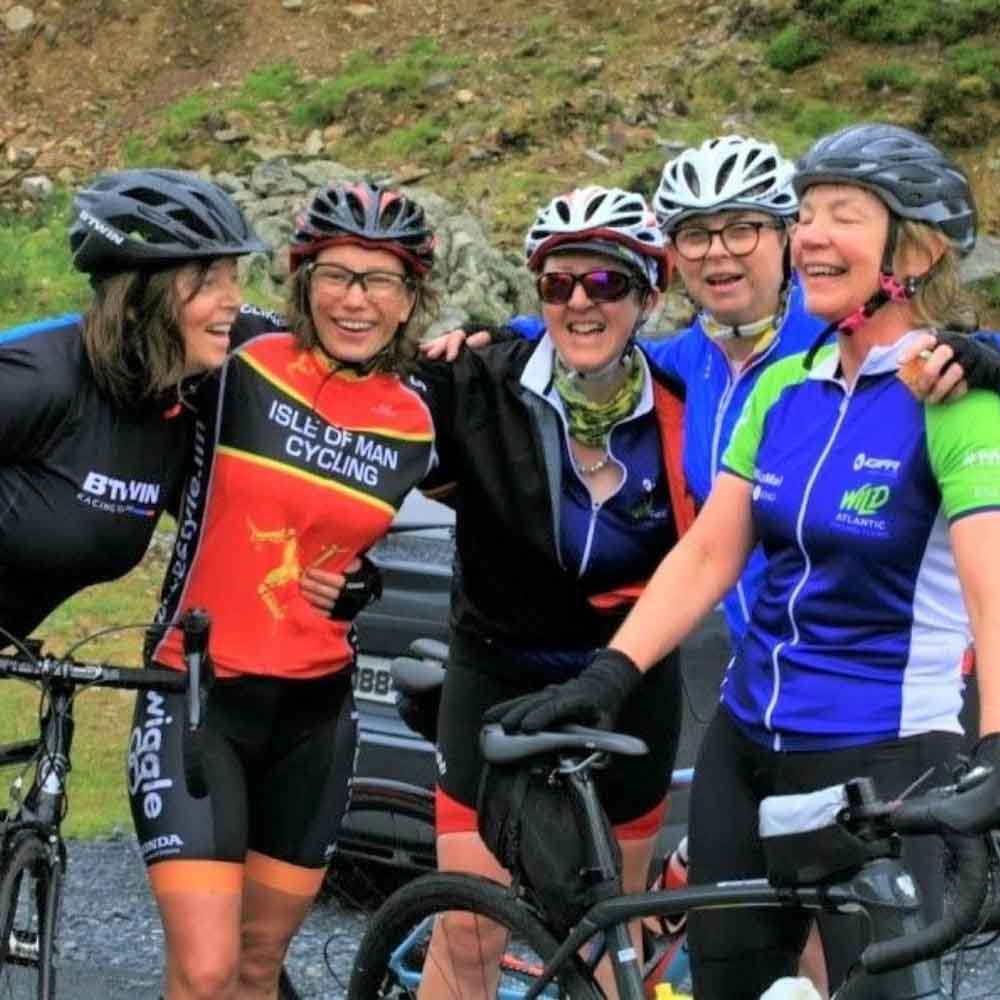 Cyclists Celebrating their hill climbs on MizMal cycling route